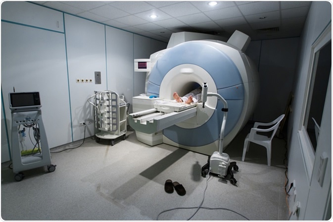 Patient being scanned and diagnosed on a MRI (magnetic resonance imaging) scanner in a hospital. Image Credit: zlikovec / Shutterstock