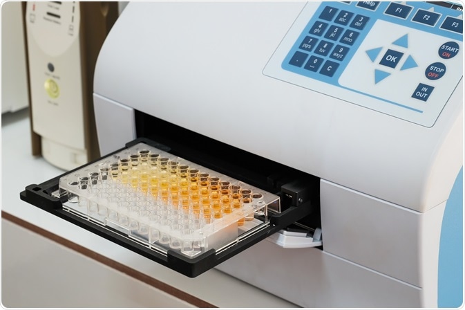 An ELISA plate going into a plate counter - image taken by Khamkhlai Thanet