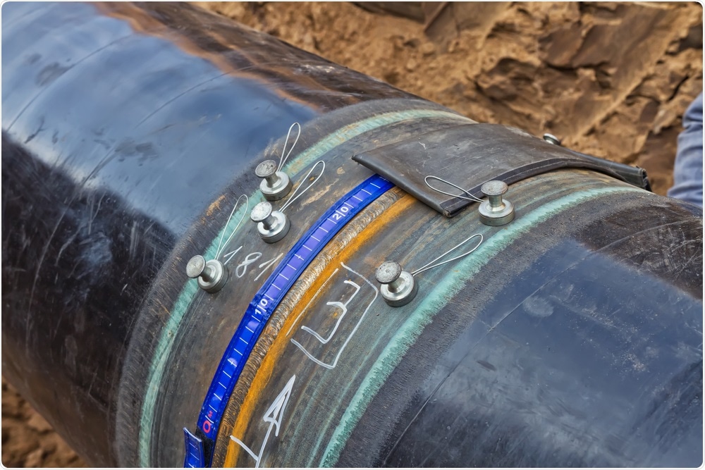 Non-destructive testing on a pipe.