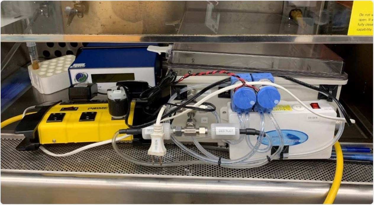 Picture of prototype ozone chamber inside fume hood for kill efficacy testing