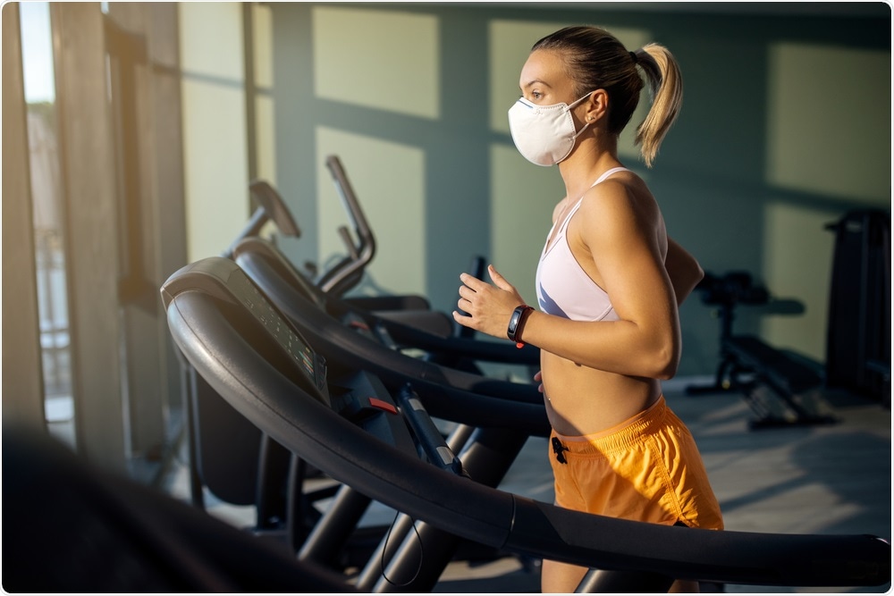 Woman wearing mask and exercising