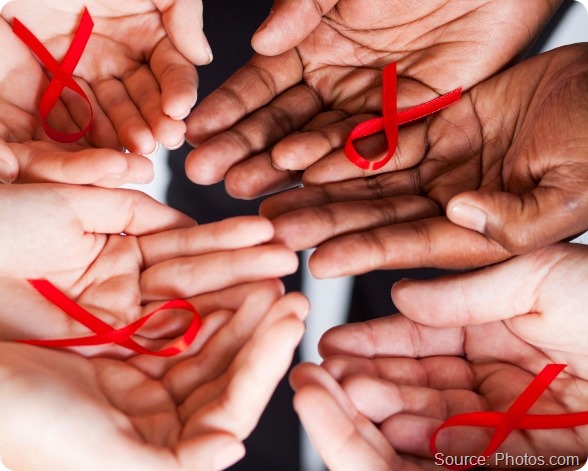 multiracial people holding red ribbon for AIDS HIV awareness