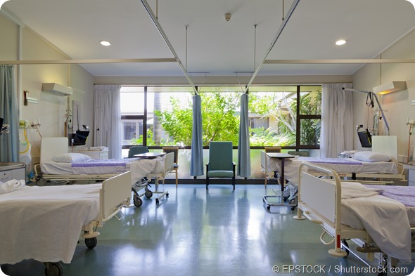 Hospital ward with beds and medical equipment