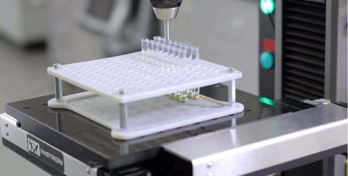 Automated XY stage for tensile, compression, and flexure testing