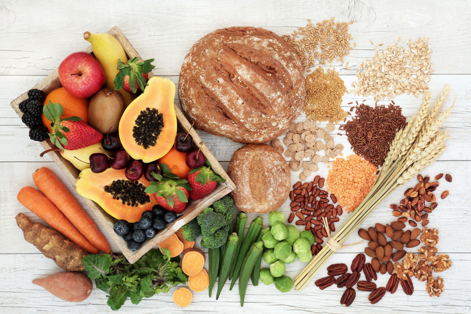 Healthy high fibre diet food concept with legumes, fruit, vegetables, wholegrain bread, cereals, grains, nuts and seeds