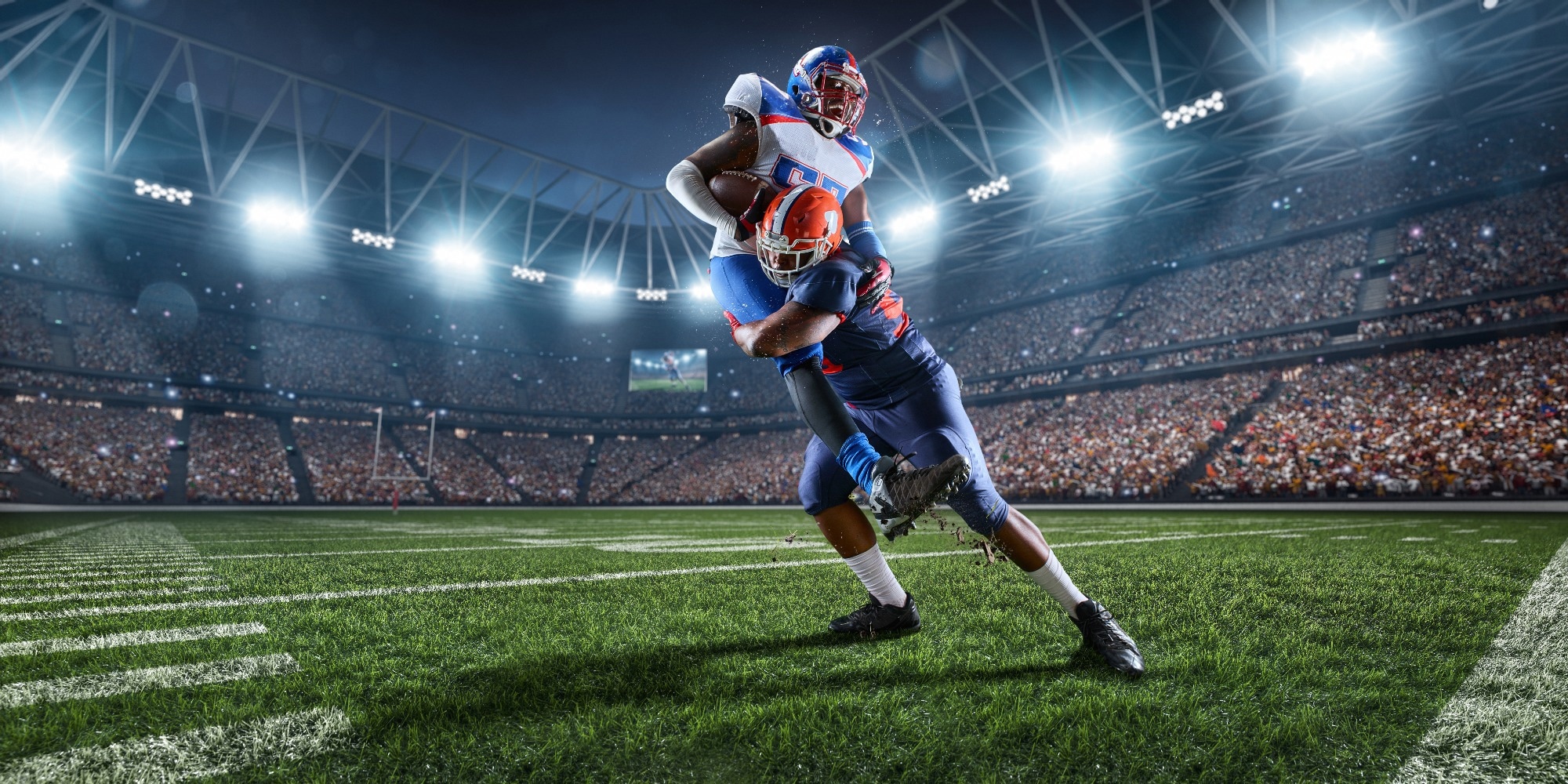American football players preforms an action play in professional sport stadium