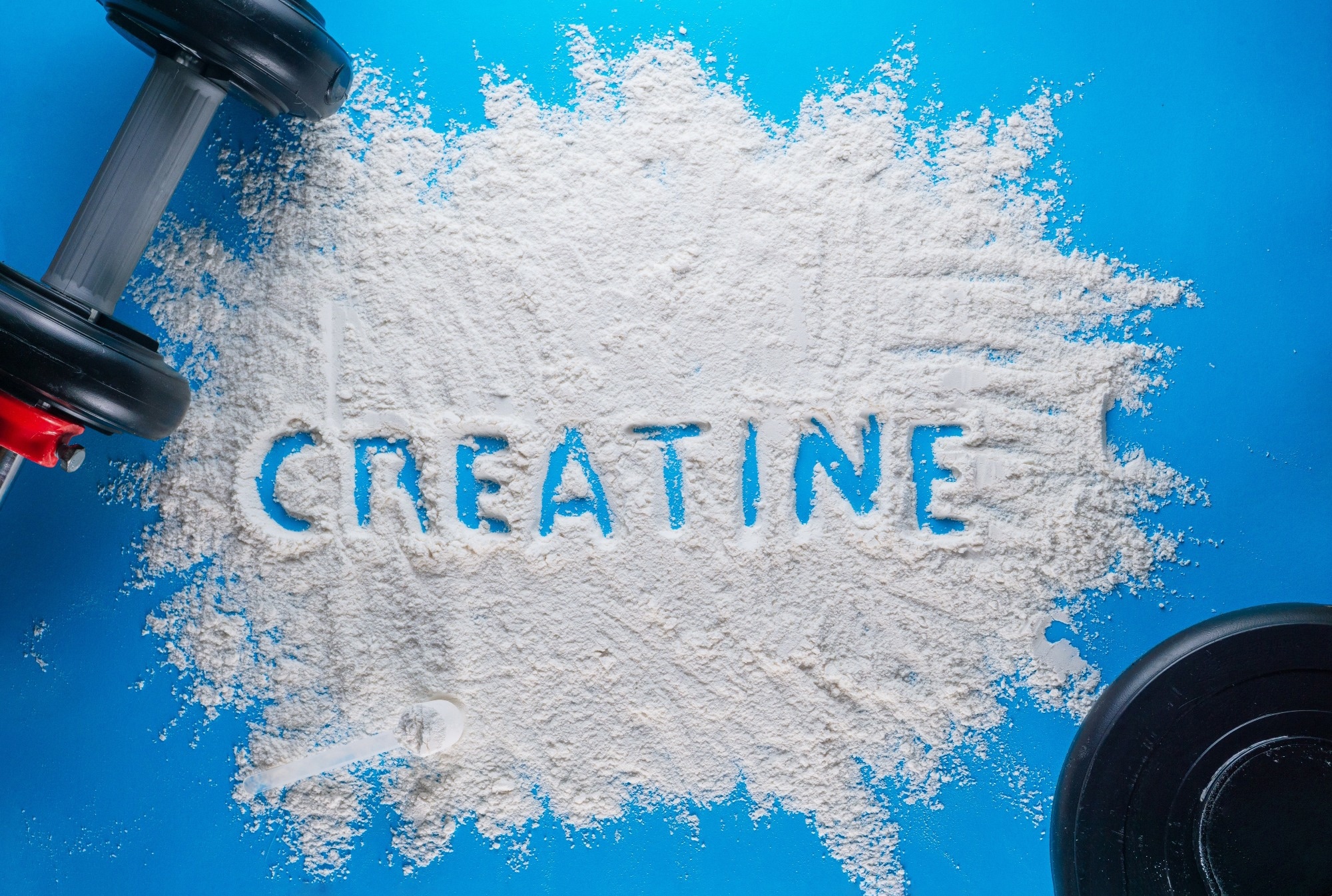 the word creatine written on a white powder.